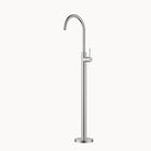 Stainless steel freestanding bathtub faucet on a white background