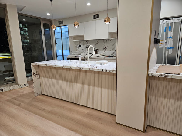 Modern kitchen with marble island and cabinets
