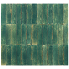 A square arrangement of rectangular green mosaic tiles with a distressed, textured finish showing variations in teal, forest green, and subtle brown undertones.