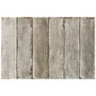 Six vertical rectangular concrete-look tiles in a light gray to taupe-brown finish, arranged side by side on a white background.