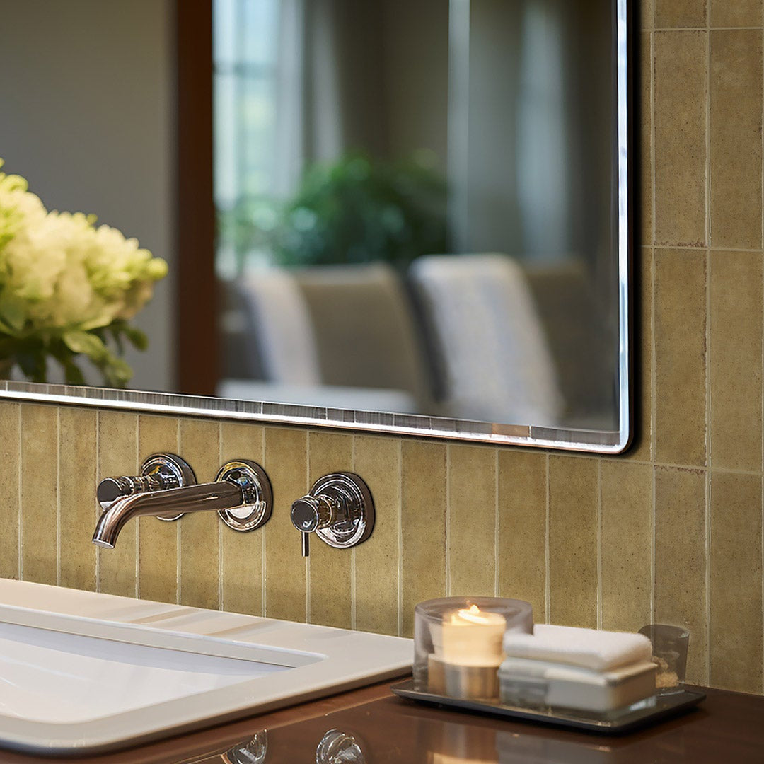 Bathroom sink with flowers and mirror reflecting the room