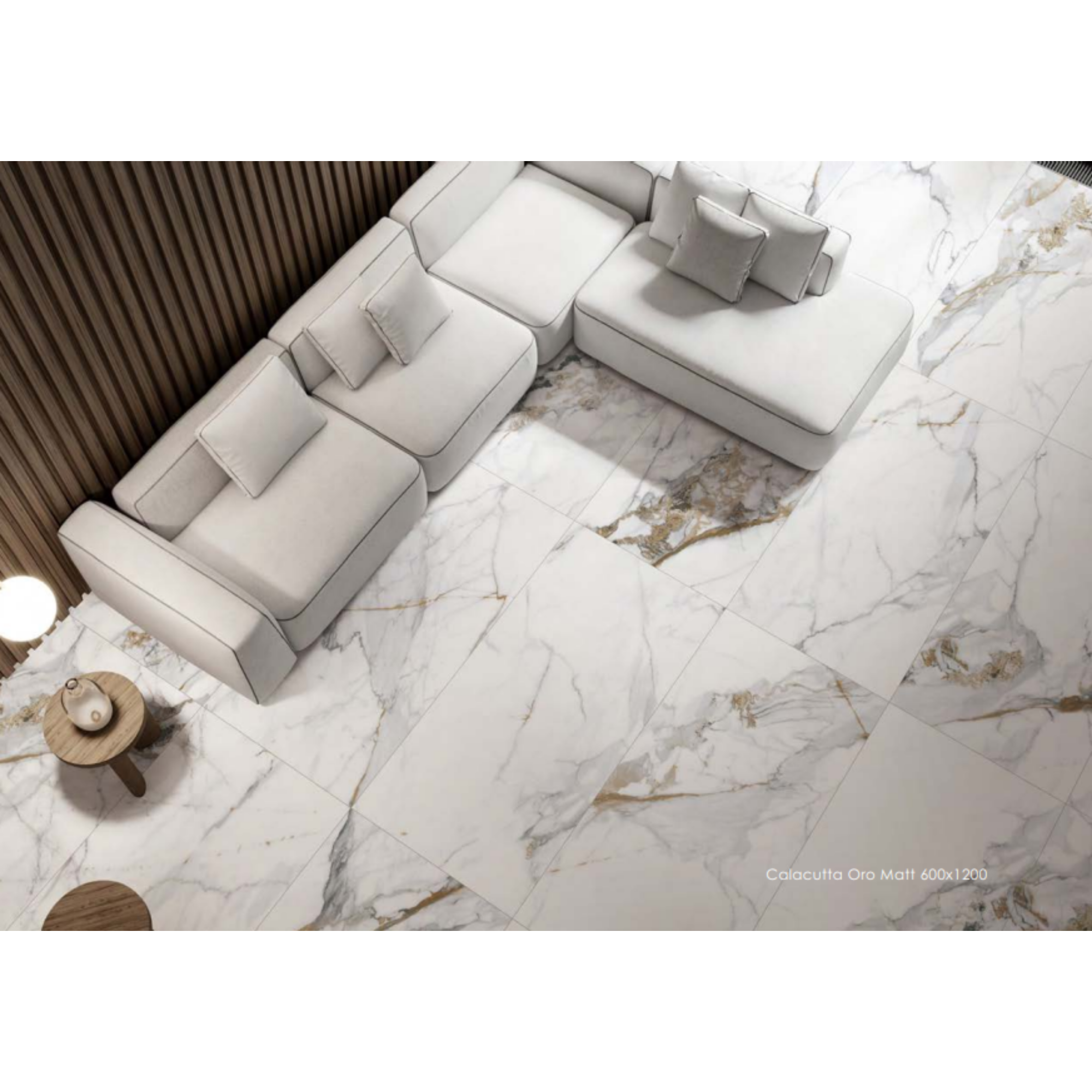 Calacatta Oro marble-look tile example in a lounge or living room.