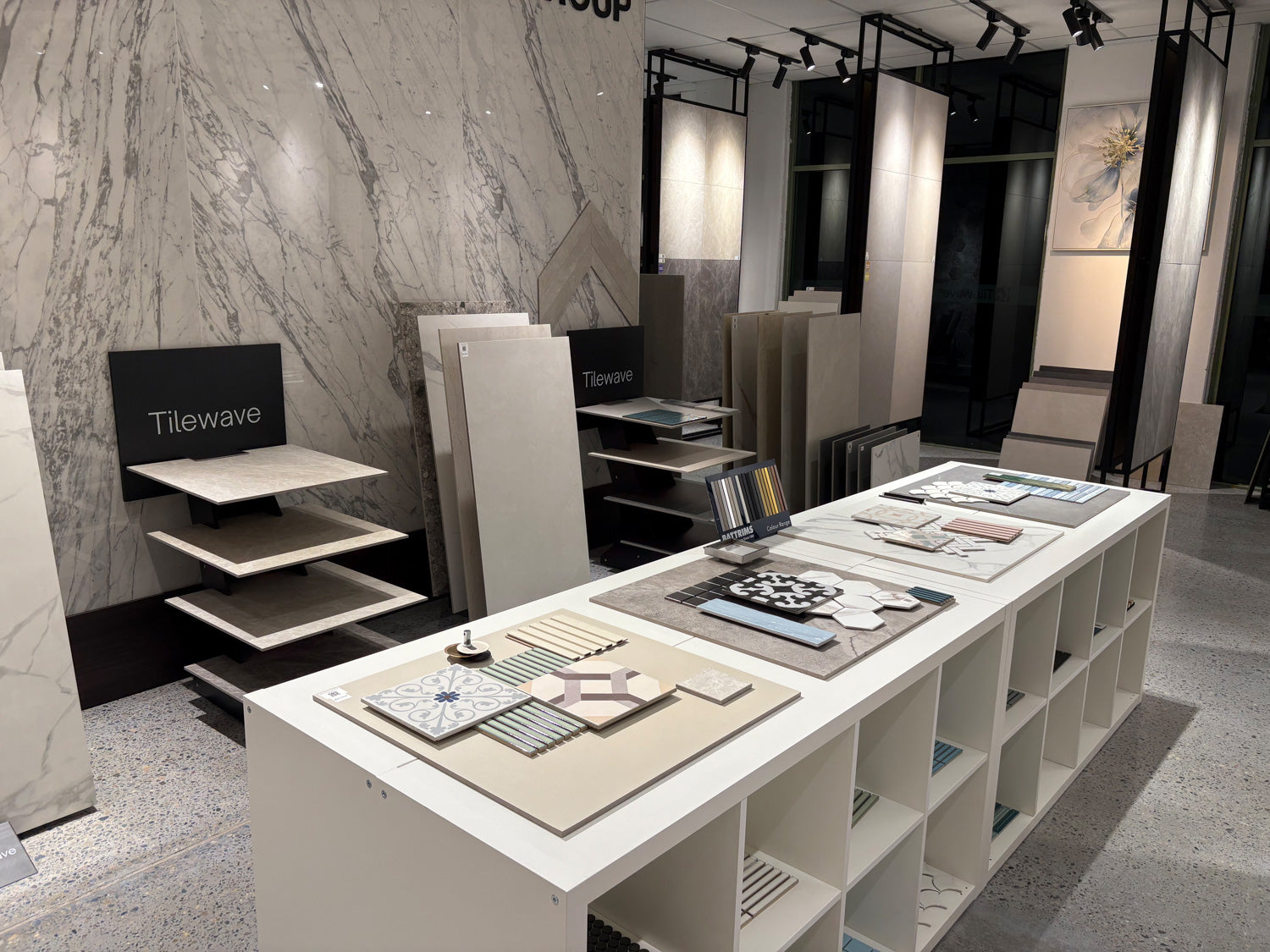 Display of tiles and marble samples in a showroom setting